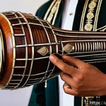 라트비아 전통 악기 - A traditional Gudrees musical instrument made from polished wood and metal, showcasing its deep and ...